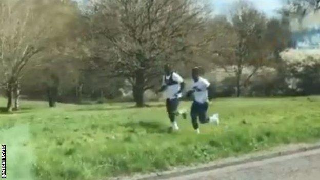 Tottenham Hotspurs players Davinson Sanchez and Ryan Sessegnon pictured jogging closely together.