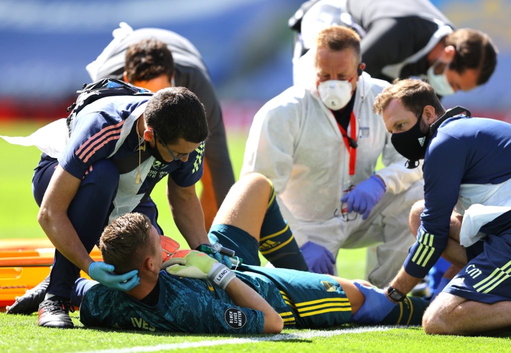 Arsenal goalkeeper Bernd Leno being attended to during the match.