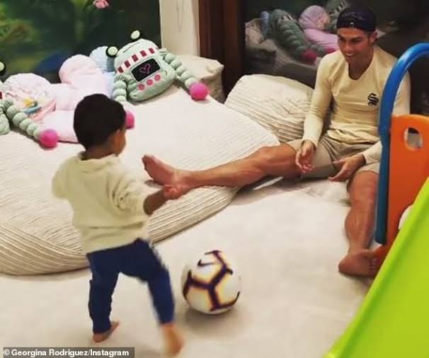 Mateo Ronaldo playing football with his father 