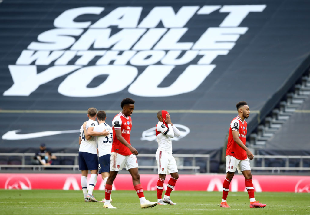 Arsenal players walking away after the bitter defeat in the hands of Tottenham 