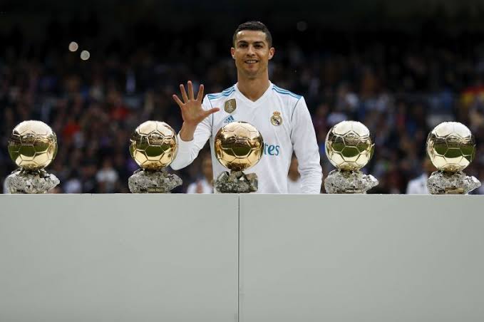 Cristiano displaying his five Ballon d'Or