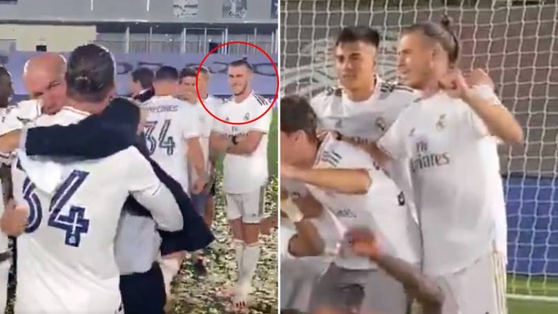 Gareth Bale watch as Real Madrid's players celebrate Zinedine Zidane