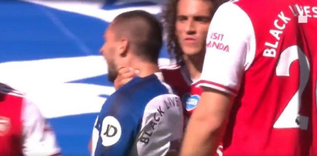 Matteo Guendouzi holding tight to Neal Maupay's neck on June 20.
