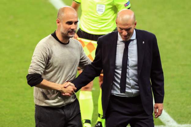 Manchester City's manager Pep Guardiola and Zinedine Zidane after their encounter on Friday.