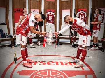 Pierre-Emerick Aubameyang and his closest friend at Arsenal Alexandre Lacazette making a toss with the FA Cup Trophy on Saturday. 