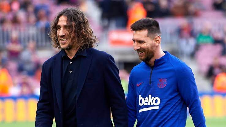 Carles Puyol and Lionel Messi