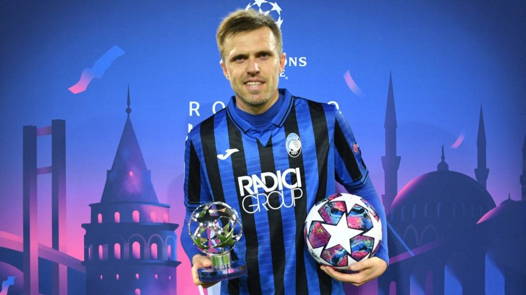 Josip Ilicic with a man of the match award and a football after scoring a hat trick in a Champions League match.