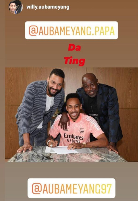 Aubameyang's brother William and his father Pierre at the table to witness the signing of the player's new deal. 