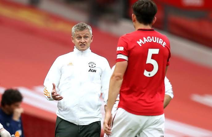  Harry Harry Maguire and the club's coach Ole Gunnar Solskjaer.