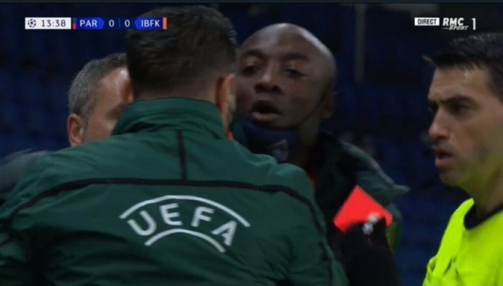 Istanbul Basaksehir assistant coach Pierre Webo protesting for being called the "N" word. 