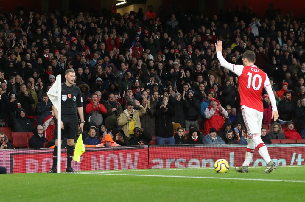 Mesut Ozil gets a standing ovation during a league match at the Emirates Stadium.