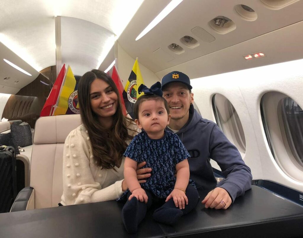 Mesut Ozil and his family on board a plane to Turkey.