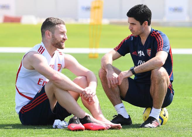 Shkodran Mustafi and Arsenal's coach Mikel Arteta.