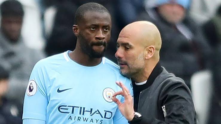 Yaya Toure with Pep Guardiola during his time at Manchester City.