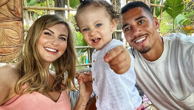Chris Smalling, his wife Sam Cooke, and his son Leo.