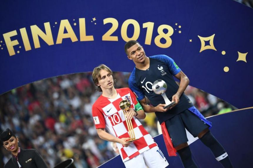 Luka Modric and Kylian Mbappe flaunting their awards at the 2018 FIFA World Cup.