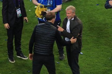 Thomas Tuchel and the owner of Chelsea football club, Roman Abramovich meet on the pitch after the UEFA Champions League final. 