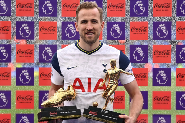 Harry Kane posses with his golden boot and playmaker awards.