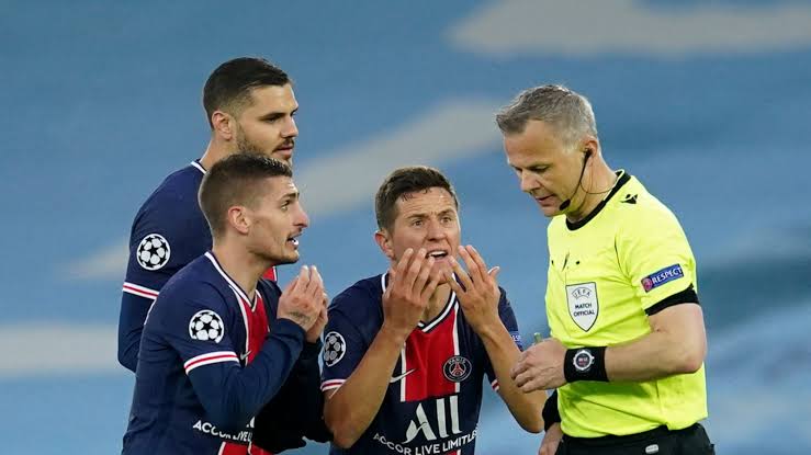PSG players pleading with referee Bjorn Kuipers not to send off Angel Di Maria.