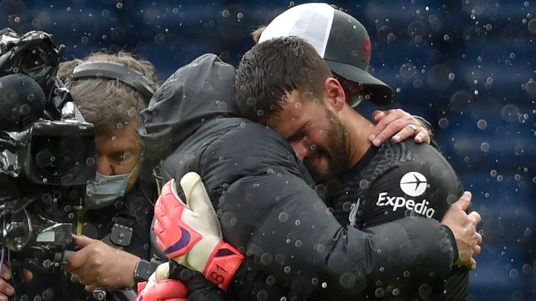 Alisson and Liverpool's coach Jurgen Klopp exchanged a deep hug after a 2-1 victory over West Brom.