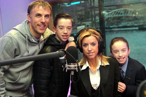 Phil Neville, his wife Julie, and their two children Harvey and Isabella.
