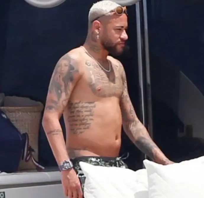 Neymar looking out of shape while enjoying his holiday.