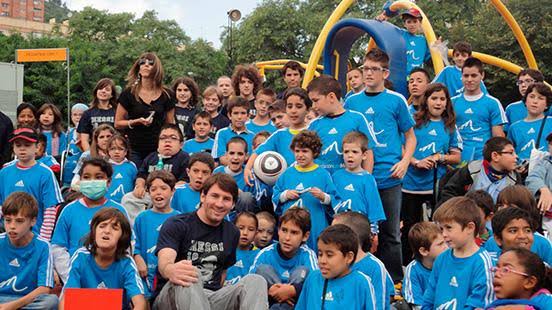 Lionel Messi and children from his foundation.
