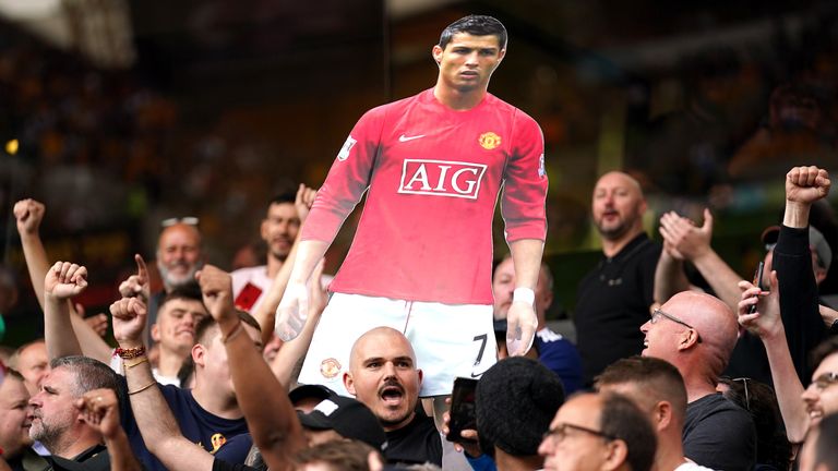 Manchester United fans display a cardboard cut-out of Cristiano Ronaldo during Sunday's Premier League 1-0 victory over Wolves.