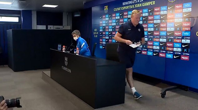 Ronald Koeman walking out of the press conference after reading out his statement. 