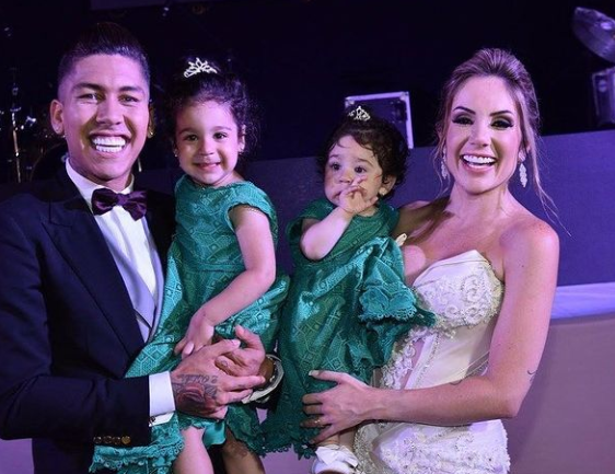 Larissa Pereira, Roberto Firmino, and their two daughters during their wedding ceremony in 2017.