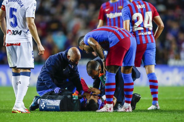 Doctors attending to Sergio Aguero during the league game between FC Barcelona and Alaves on Saturday. 