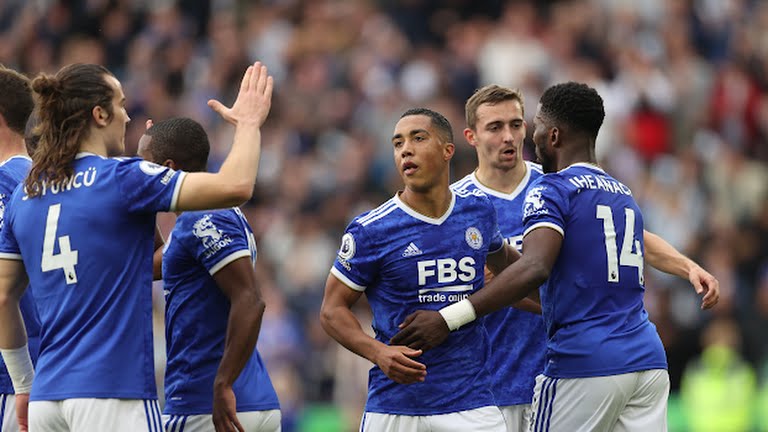 Leicester City Players celebrate with Youri Tielemans after scoring against Manchester United. 