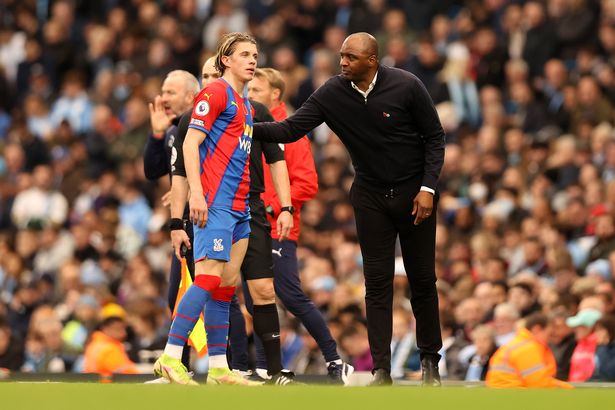 Conor Gallagher taking instructions from Crystal Palace coach Patrick Vieira.