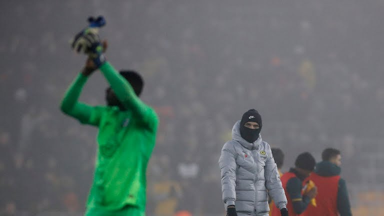 Chelsea goalkeeper Edouard Mendy and the club's coach Thomas Tuchel after the league game against Wolves played under foggy weather. 