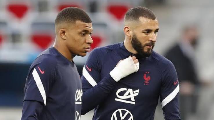 Kylian Mbappe and Karim Benzema in France's national team colors. 