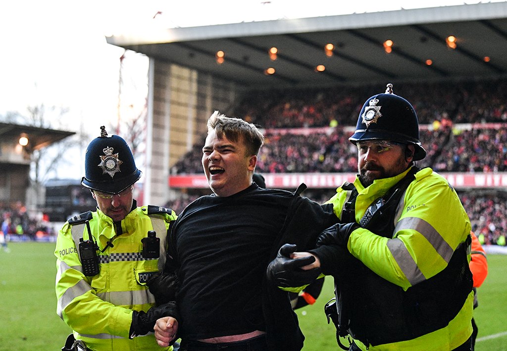 The Leicester City fan that attacked Nottingham Forest player with security operatives. 