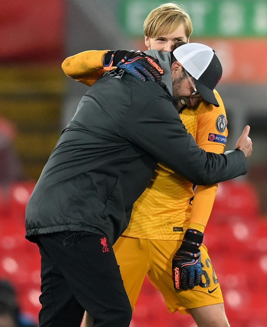 Coach Jurgen Klopp of Liverpool embraces Caoimhin Kelleher after a game. 