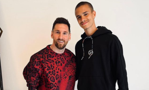 Lionel Messi stands out in a scarlet leopard suit as Romeo Beckham meets PSG's star and receives a signed Neymar shirt