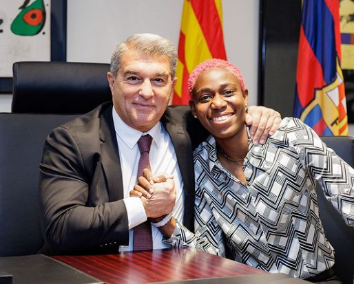 Asisat Oshoala poses with Barca president Joan Laporta as she extends her contract