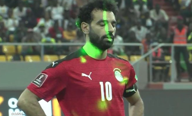 Mohamed Salah of Egypt was forced to play his penalty to the sky due to 'barrage of lasers' from Senegal fans