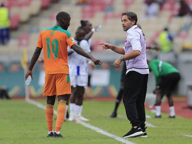 Ivory Coast manager Patrice Beaumelle and Nicolas Pepe. 