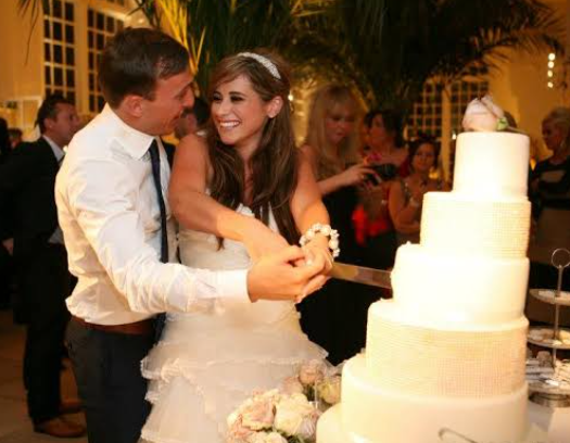 Mark Noble and his wife, Carly Noble during their wedding day in 2012.