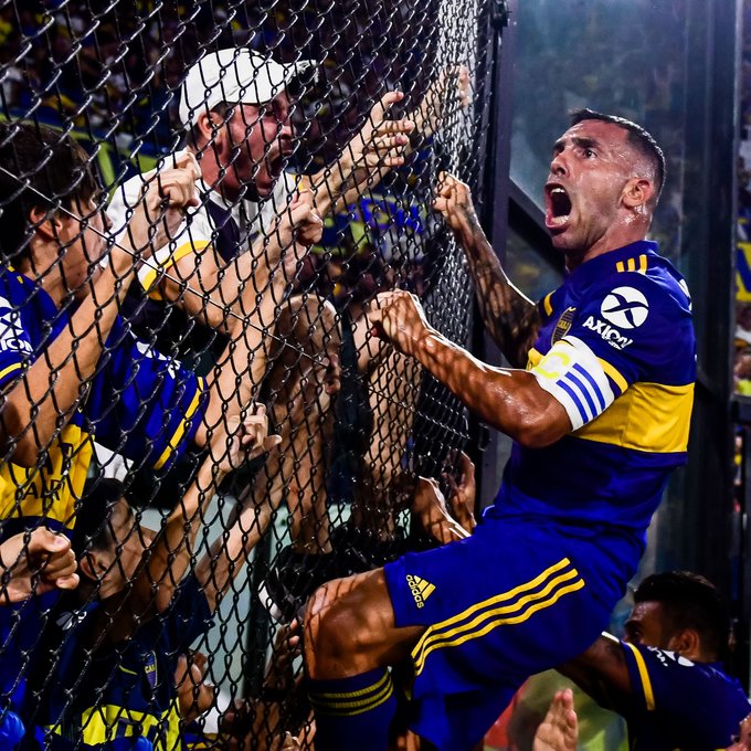 Carlos Tevez celebrates with fans at Boca Junior. 