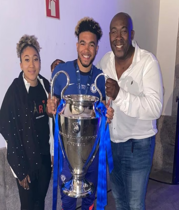 Nigel James and his two children - Chelsea's star Reece James and Manchester United's female star Lauren James posing with the 2021 Champions League trophy. 