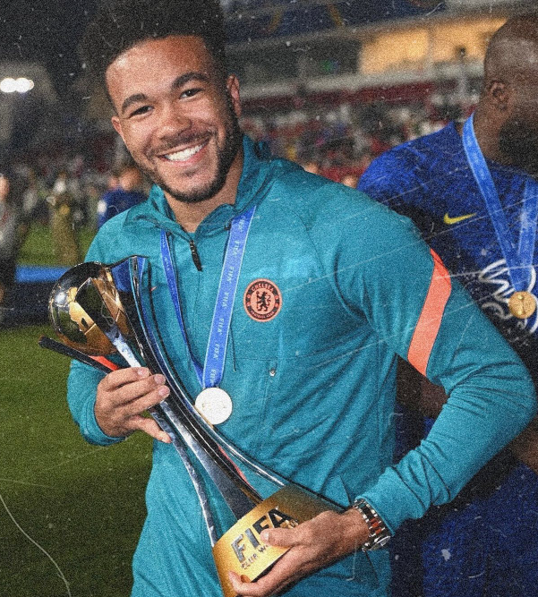 Reece James posing with the 2021 FIFA Club World Cup trophy. 