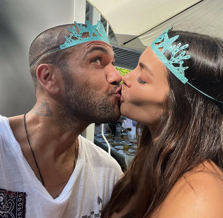  Alves and his wife Joana Sanz kiss to celebrate their marriage anniversary. 
