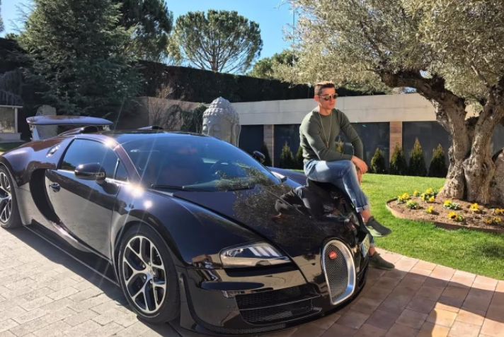 File photo of Ronaldo chilling on his £1.7million Bugatti Veyron.