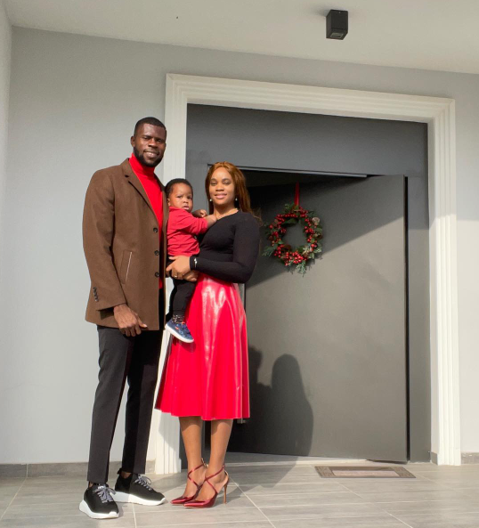 Francis Uzoho, his wife Sommie, and their first child. 