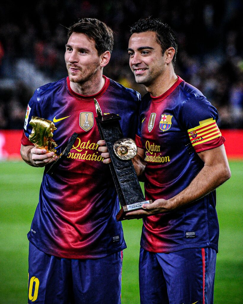 File photo of Lionel Messi and Xavi Hernandez.