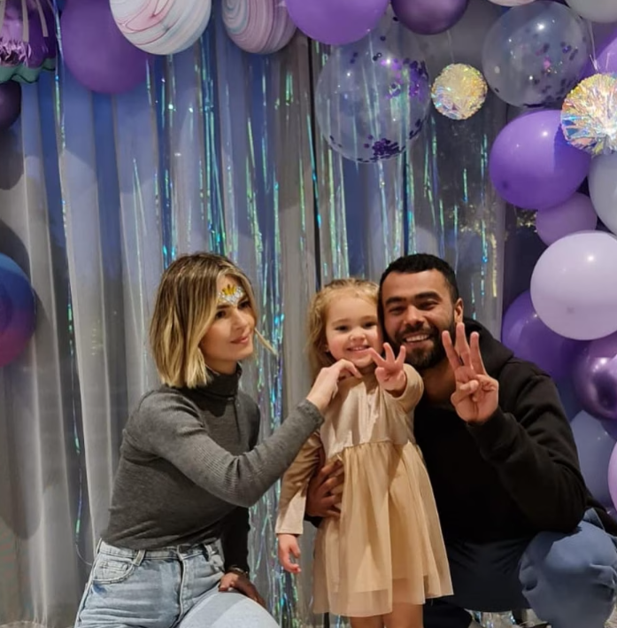 Ashley Cole, his partner Sharon Canu, and his daughter Grace. 